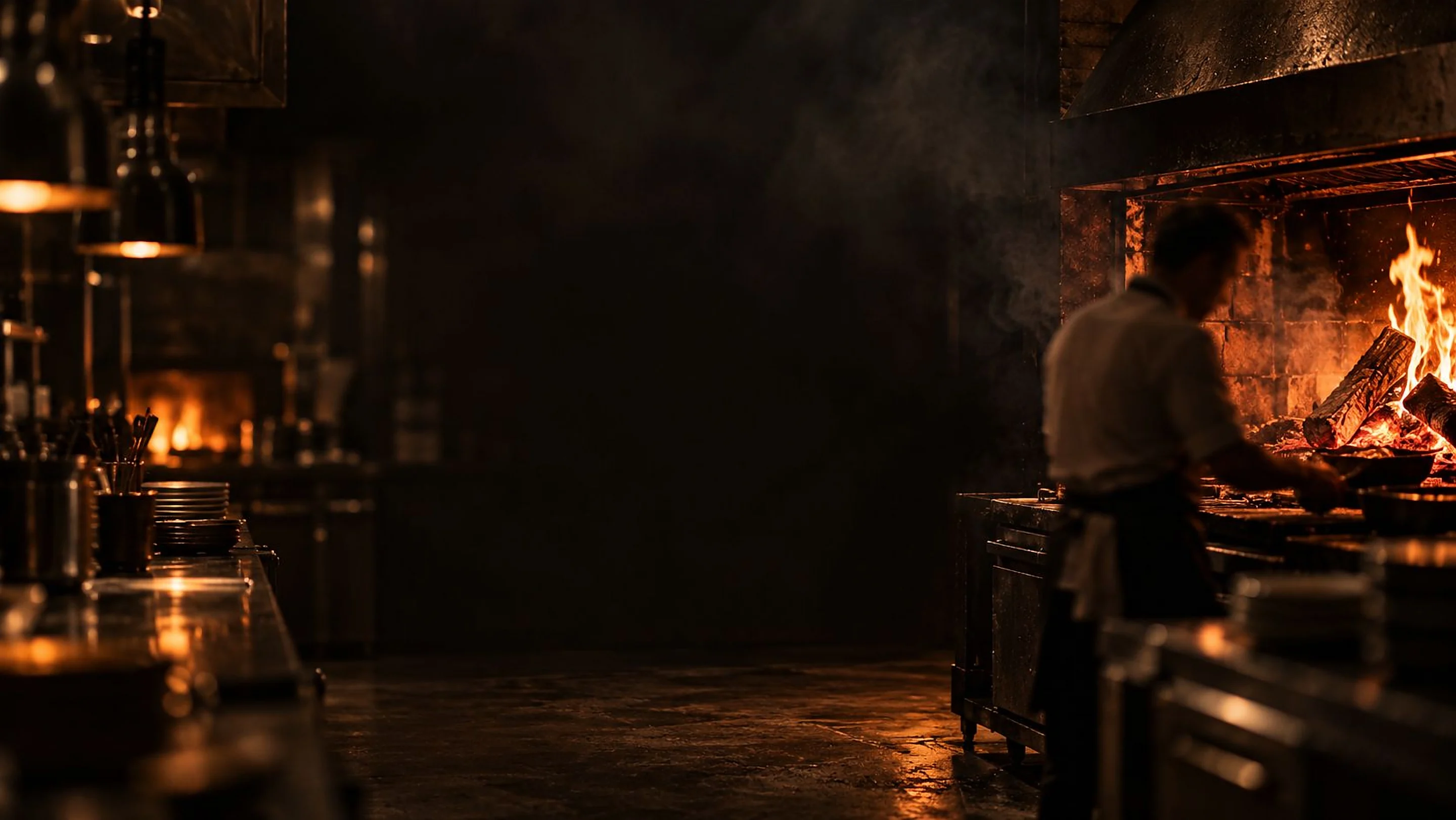 The Ember & Rye kitchen before service, the wood fire already burning